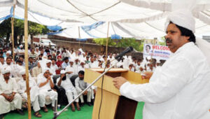 Minister for Revenue, Relief and Rehabilitation Raman Bhalla addressing public gathering at Bathindi on Sunday.