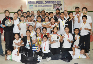 Triemphant Speedball players of J&K State team posing for a group photograph alongwith officials on Wednesday.