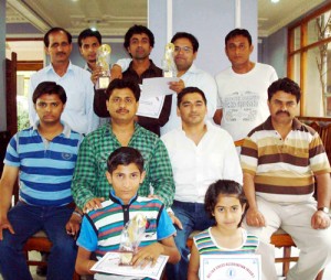 Winners along with the office bearers of All J&K Chess Association posing for a group photograph at Jammu on Sunday.