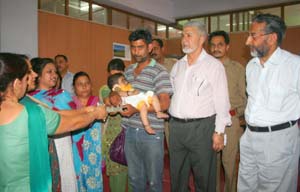 Judicial employees alongwith ailing girl child at Jammu on Wednesday. Judicial employees alongwith ailing girl child at Jammu on Wednesday.