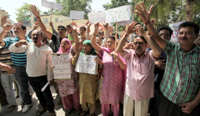 Relief holders protesting in front of RC Office at Jammu on Wednesday. -Excelsior/Rakesh Relief holders protesting in front of RC Office at Jammu on Wednesday. -Excelsior/Rakesh