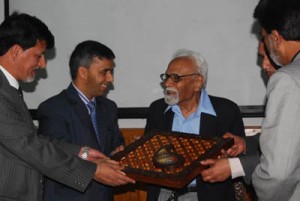 Officials of MERC presenting gift to Prof Manzoor-ul-Amin at Kashmir Varsity on Monday. Officials of MERC presenting gift to Prof Manzoor-ul-Amin at Kashmir Varsity on Monday.