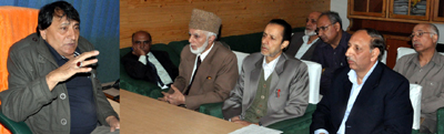 Minister for Consumer Affiars and Public Distribution, Qamar Ali Akhoon chairing meeting with dignitaries on Thursday.