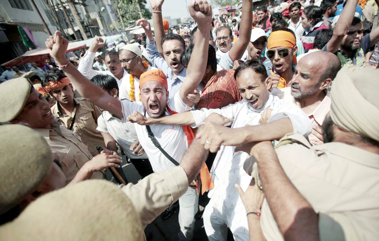 Enthusiastic VHP workers trying to break police cordon before being arrested at Parade in Jammu on Sunday. (Another Pic on Page 6)		-Excelsior/Rakesh