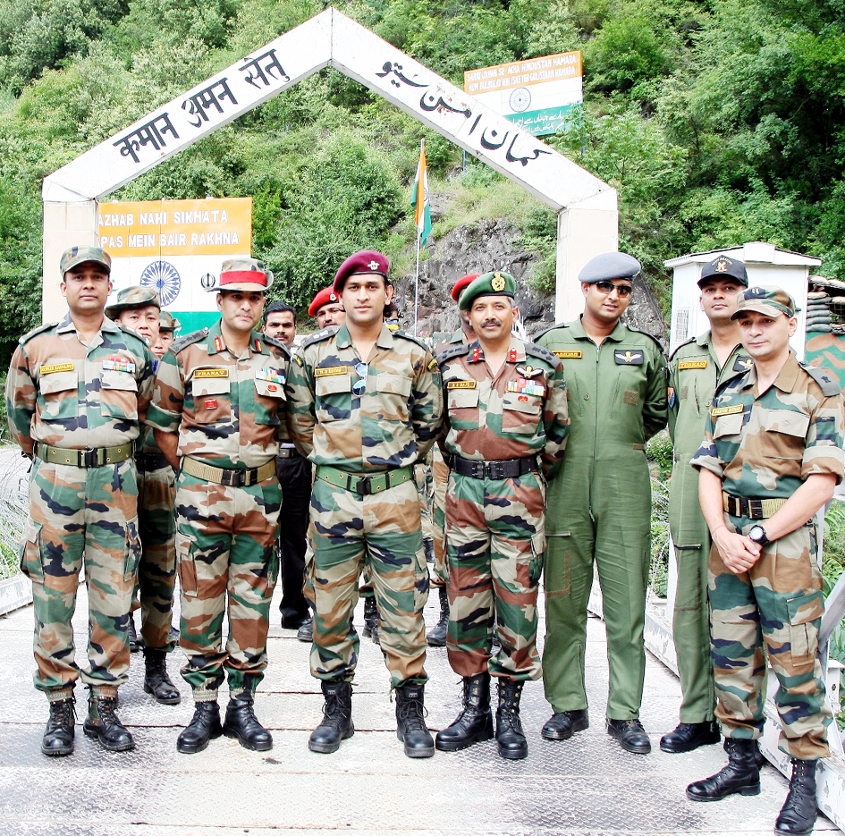 Indian cricket team captain, Lt Col (Hony) M S Dhoni with Army soldiers at Kaman Post on LoC in Uri sector on Sunday. Indian cricket team captain, Lt Col (Hony) M S Dhoni with Army soldiers at Kaman Post on LoC in Uri sector on Sunday.