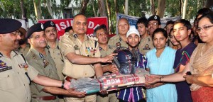 DGP K Rajendra distributing sports gear among SOS children in Jammu on Tuesday. DGP K Rajendra distributing sports gear among SOS children in Jammu on Tuesday.