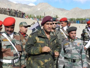 Team Indian Captain M S Dhoni, flanked by senior army officers moving to cricket ground to see match at Leh on Tuesday