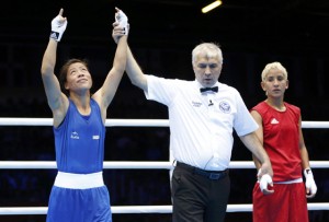 India's Chungneijang Mery Kom Hmangte is declared the winner over Maroua Rahali of Tunisia after their quarterfinal Women's Fly (51kg) boxing match at the London Olympic Games