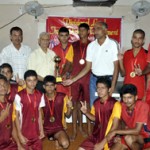 Kathua District Volleyball team players receiving runners-up trophy from the chief guest, I D Soni, State Commissioner Bharat Scouts & Guides at Youth Hostel Nagrota on Tuesday.