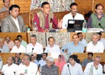 Minister for Health and Family Welfare, Sham Lal Sharma reviewing the functioning of Health Department in a meeting at Budgam on Thursday.