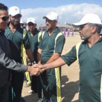 Minister for Sports R S Chib interacting with players while inaugurating Cricket Tournament at Budgam on Tuesday.