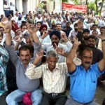 SRTC workers staging protest dharna in Jammu on Friday.