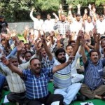Estates employees staging protest dharna in Jammu on Saturday.
