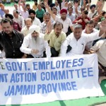 State Govt employees staging protest dharna near Press Club in Jammu on Saturday.