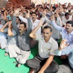 Govt employees staging protest dharna outside Divisional Commissioner's office at Jammu on Wednesday. -Excelsior/ Rakesh