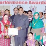 Minister for Health, Sham Lal Sharma giving award to medical fraternity at Annual Award Ceremony on Thursday.