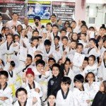 Budding Karatekas posing for a group photograph after qualifying the belt grading test on Sunday.
