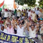 Displaced persons from PoJK staging protest demonstration at Mubarak Mandi in Jammu on Sunday.