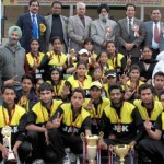 Triumphant J&K boys and girls Tennis Ball Cricket teams posing for a group photograph along with Minister for Sports RS Chib and other dignitaries at MA Stadium in Jammu on Saturday. -Excelsior / Rakesh