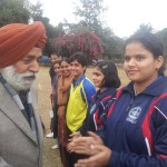 Jaipal Singh, Director Youth Services and Sports interacting with the players and officials of J&K girls team during the semifinal match at Jammu University ground on Friday.