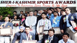 Outstanding players posing for photograph with Chief Minister at Jammu University on Tuesday.