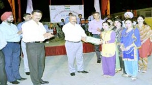 Rajeev Krishna, IG, BSF Jammu, presenting sweets to participants of cultural programme during the silver jubilee celebrations of 122 Bn, BSF.
