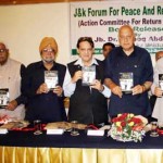 Dr Farooq Abdullah releasing a book at Jammu on Sunday.