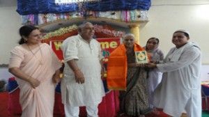 Swami Kumar Ji felicitating a woman at Zangtrai function at Roop Nagar on Saturday.
