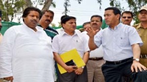Minister for ULBs, Nawang Rigzin Jora and Minister for Housing Raman Bhalla inspecting on going work on drains and nallahs at Jammu on Friday.