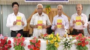 Chief Vigilance Commissioner Kuldeep Khoda, MLC Vijay Bakaya and Dr R L Shant releasing book of Dr K L Chowdhury at a function at Jammu on Sunday. -Excelsior/Rakesh