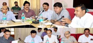 Minister for PHE Sham Lal Sharma chairing a meeting at Jammu on Thursday.