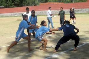 Catchers trying to get hold of the raider while raider dictating terms in their own den during an Inter-Zonal kabaddi match at HSS Domana in Jammu on Saturday.