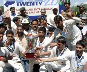Triumphant Narbal-A team posing for a group photograph after clinching T20 trophy in Budgam on Saturday.