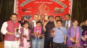 Winners of Choona Hai Aasman-III posing for a group photograph along with the dignitaries in Srinagar on Thursday.