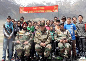 Students of Sarhad Public School with Army Officers posing for a photograph at Kargil on Tuesday.