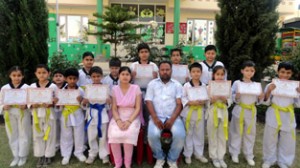 Successful candidates of Sprawling Buds School in Belt Grading Test organized by Jammu and Kashmir Taekwondo Association posing for a photograph on Friday.