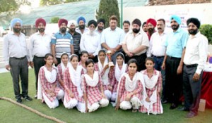 Winners of Tug of War Competition posing alongwith chief guest and other dignitaries on Tuesday.