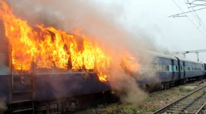A burning train at Washing Line of Jammu Railway Station on Sunday. -Excelsior/Rakesh