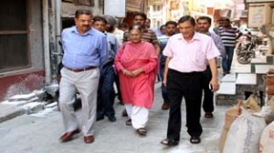 JMC Commissioner, K L Khajuria taking stock of sanitary conditions at Chand Nagar on Friday.