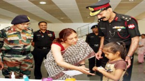 President, AWWA White Knight Corps, Rashmi Hooda interacting with a child during an event organized on World Asthma Day.