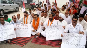 NPP activists staging protest dharna outside Press Club at Jammu on Monday. —Excelsior/ Rakesh