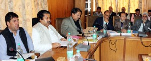 Minister for Housing Raman Bhalla chairing State Agriculture Marketing Board meeting at Srinagar on Wednesday.