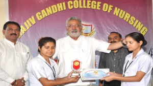 Minister for Sports Taj Mohi-ud-Din distributing prizes among students at Jammu on Thursday.