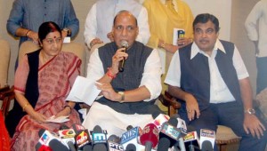BJP president Rajnath Singh, flanked by senior leaders Sushma Swaraj and Nitin Gadkari, announcing withdrawal of resignation by veteran party leader LK Advani, in New Delhi on Tuesday. (UNI)