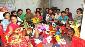 Participants during soft toy and decorative making training programme posing for photographs at Kalakote, District Rajouri on Thursday.