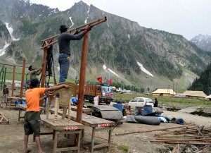 Temporary sheds and langars being set up at Baltal base camp on Tuesday. -Excelsior/Amin War