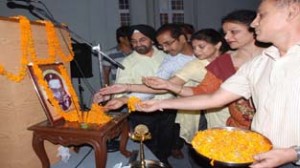 National Sample Survey officials paying tributes to Prof Mahalonobis during National Statistics Day celebration at JU on Saturday. -Excelsior/Rakesh