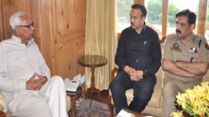 Governor N N Vohra interacting with MoS Home Sajjad Ahmad Kichloo and DGP Ashok Prasad at Raj Bhavan on Tuesday.