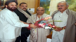 NC leaders Dr Sheikh Mustaffa Kamaal, Devender Singh Rana and Babu Ram Paul felicitating Kuldeep Sangral, son of Babu Milkhi Ram on birth anniversary of the departed leader at Jammu on Sunday.