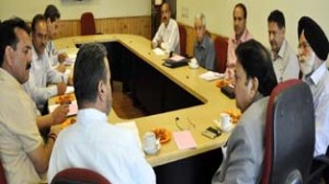 Chairman Legislative Council Amrit Malhotra chairing a meeting at Srinagar on Thursday.